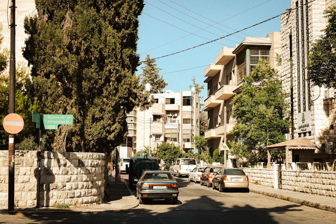 A street with cars parked on the side of it